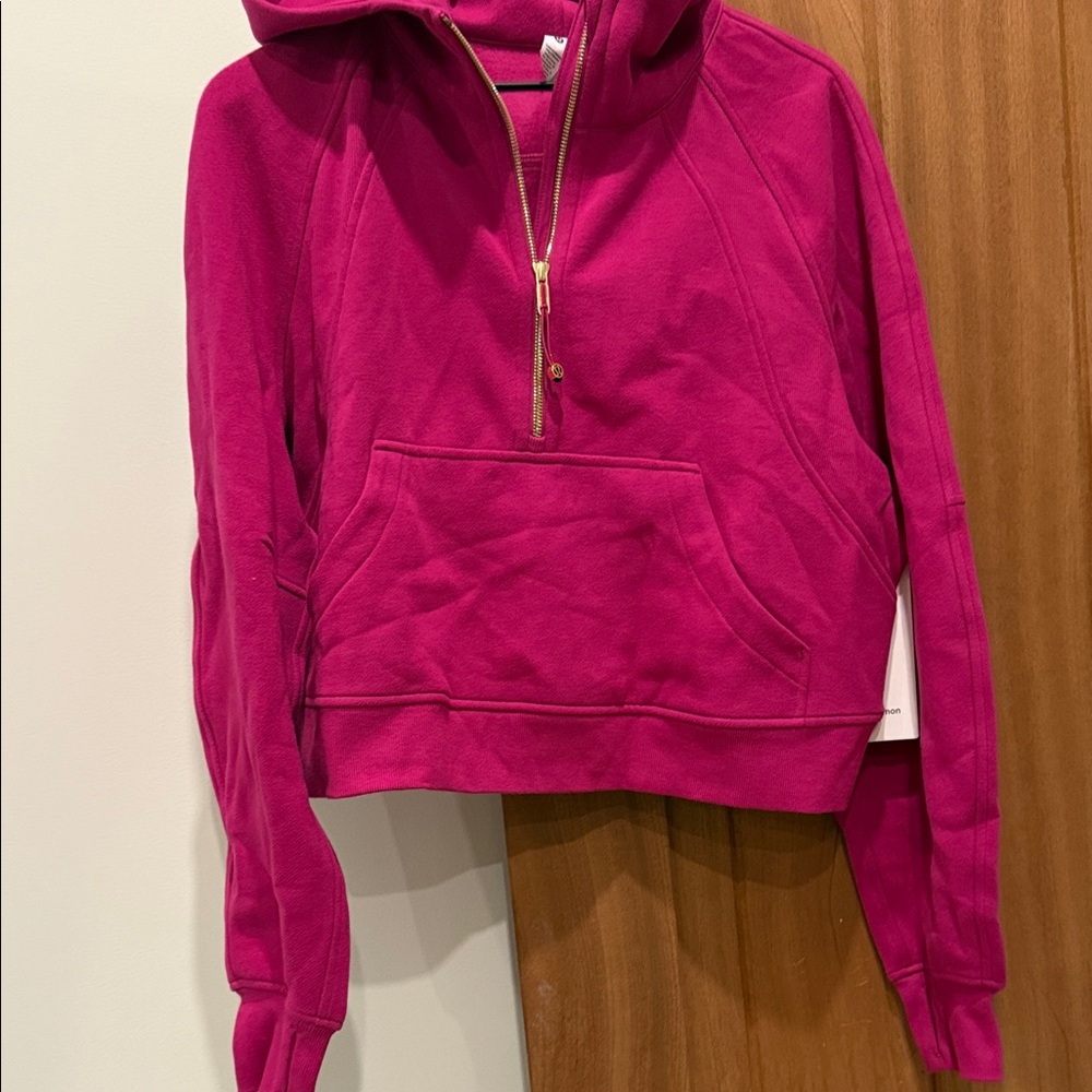 Brand new with tags Lululemon Scuba half zip with hood. M/L